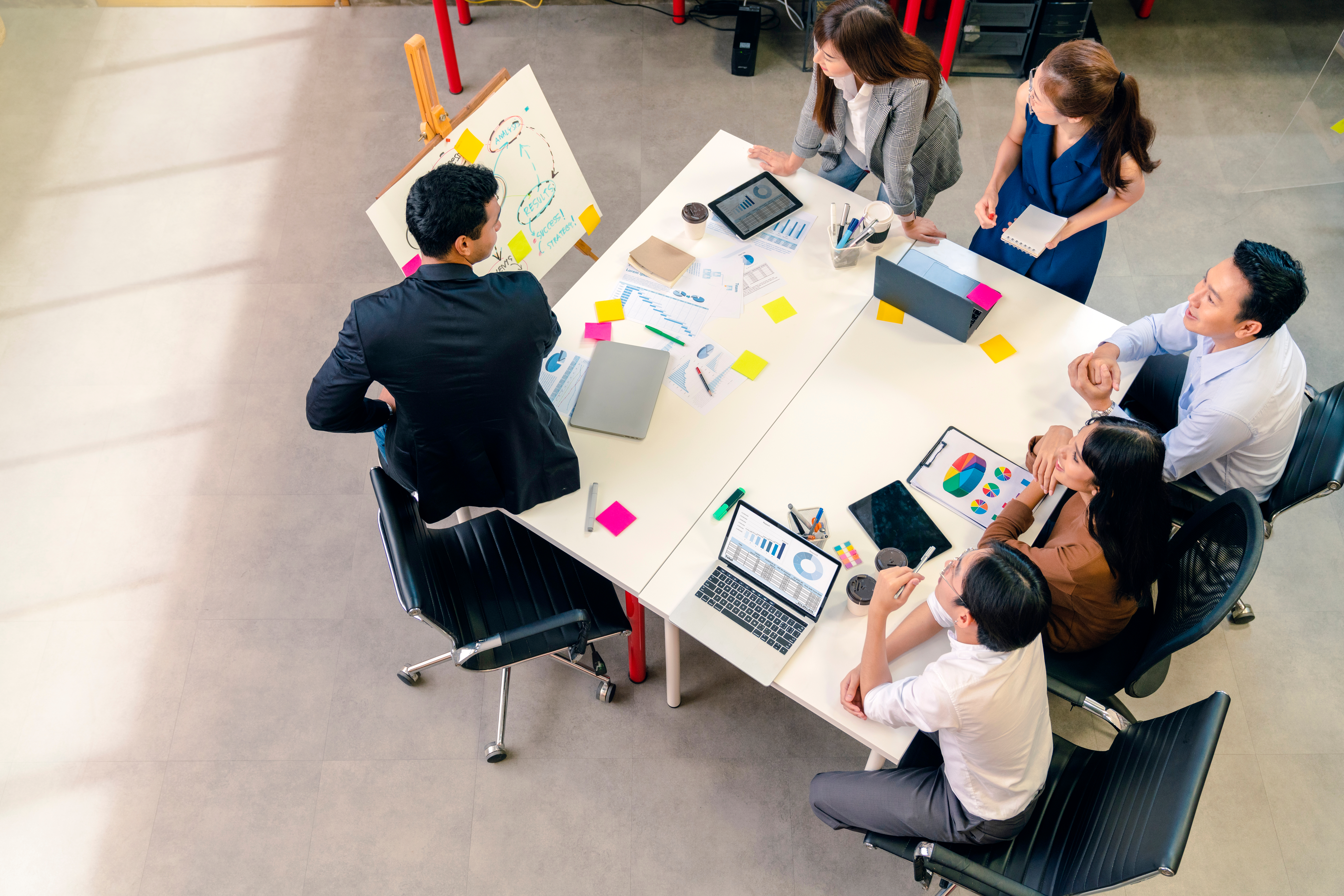 a group of professionals in a table discussing in a marketing agency