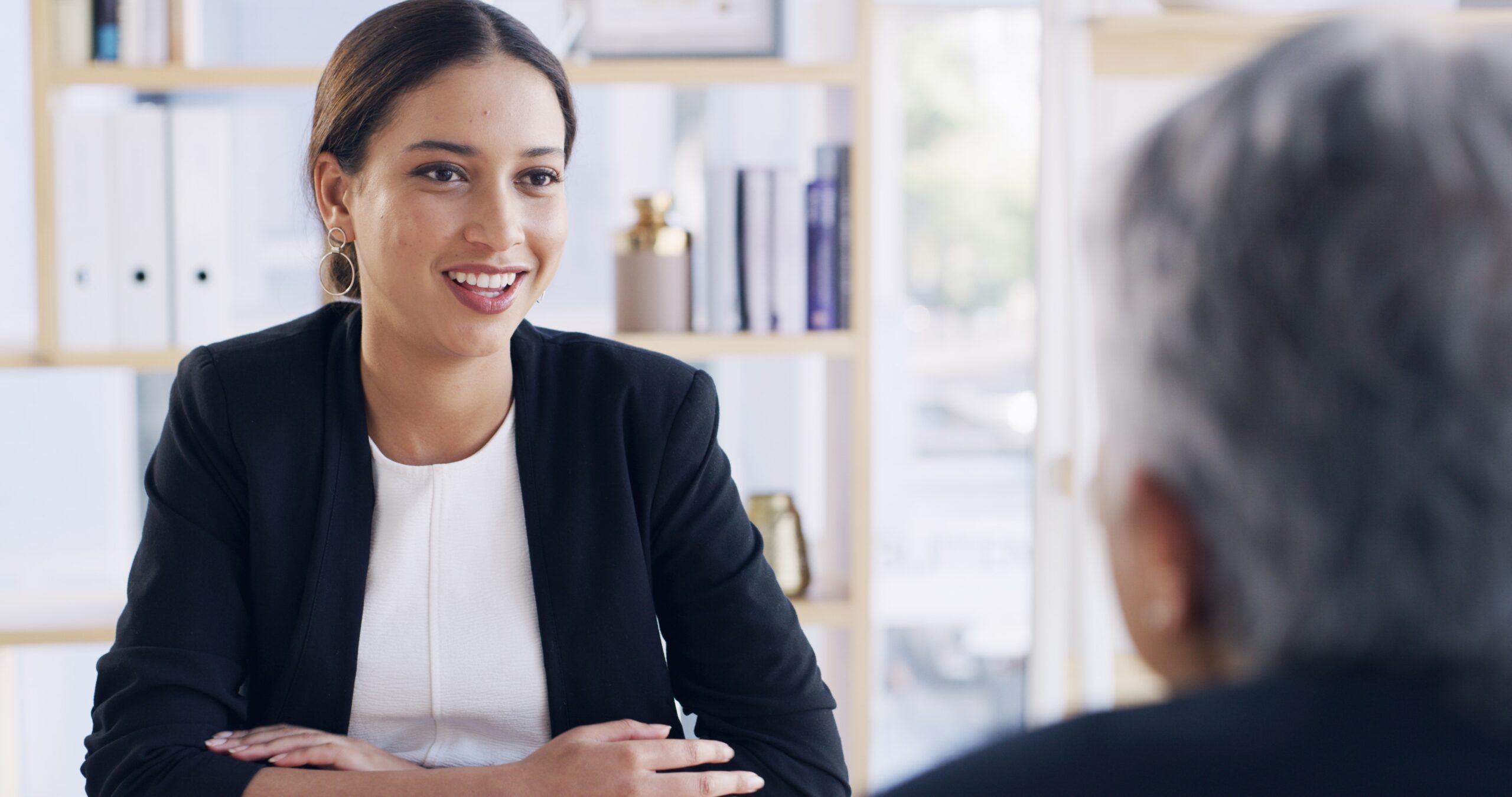 A sales rep meeting with a long-term client in January